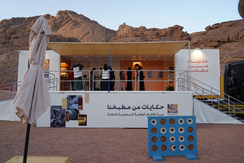 Outdoor visitor pavilion with mountains in the background