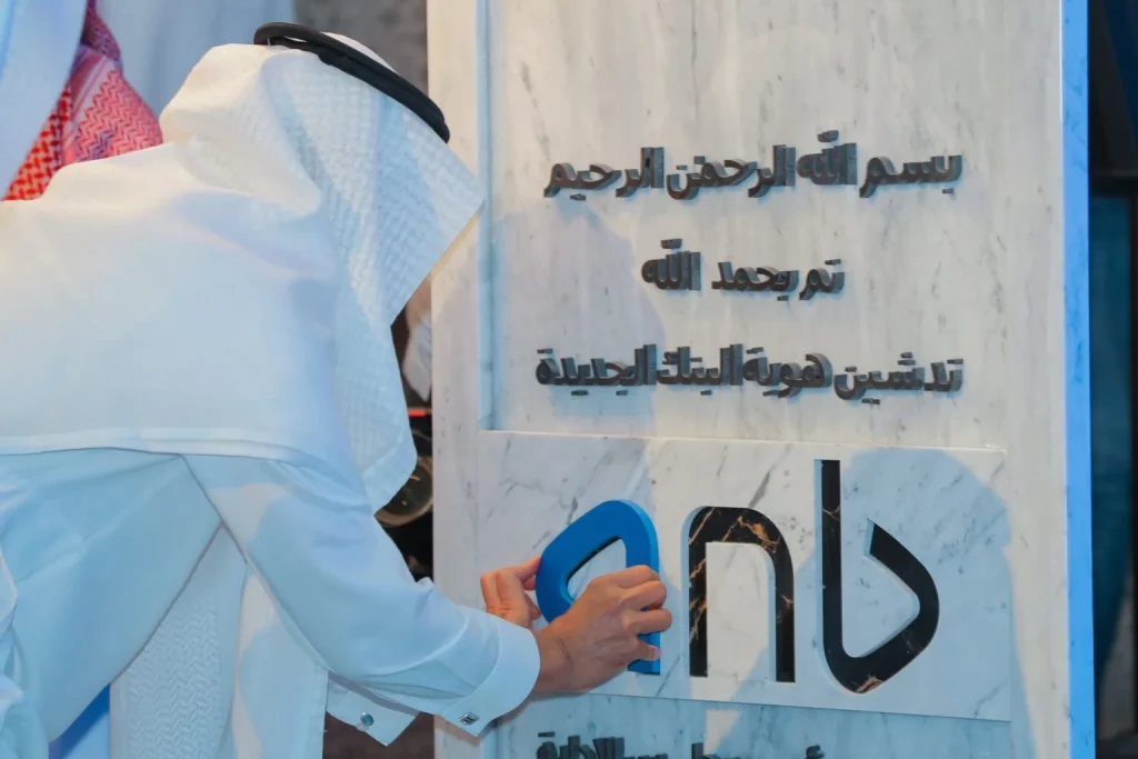 Visitor using an interactive display at an exhibition stand